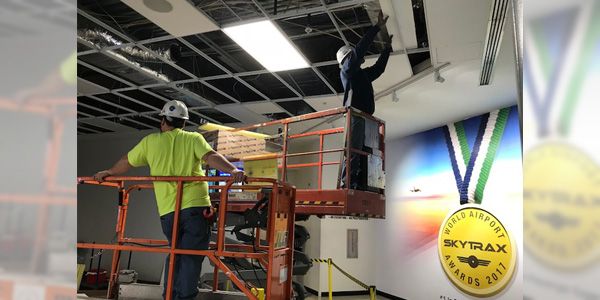 Workers at the Cincinnati/Northern Kentucky International Airport (CVG) install LSI Industries' SFP Series ultra-thin edge-lit LED flat panels