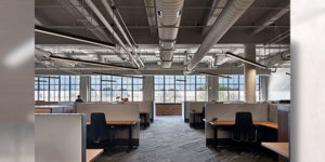 Converted Bread Factory Welcomes Credit Union Headquarters with “Celestial” Lighting